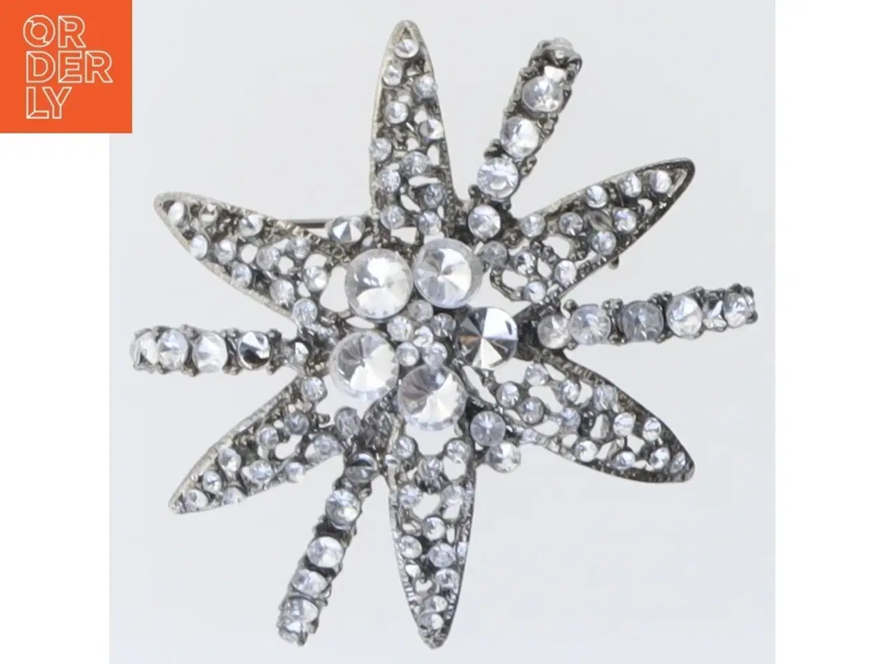 Billede 1 - Sølvfarvet stjerneformet broche (str. 5,5 cm)