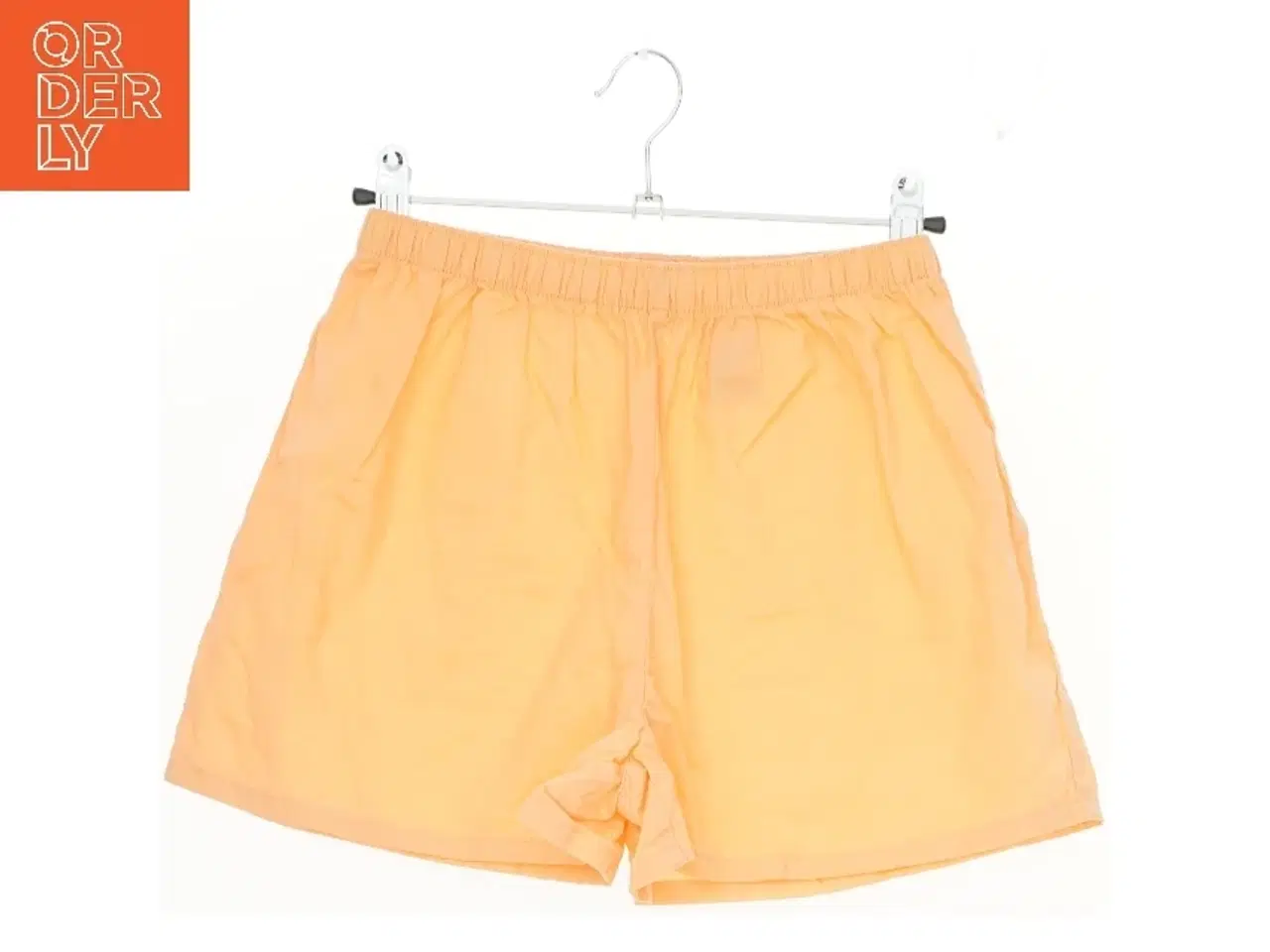 Billede 1 - Orange shorts fra H&M (str. 134)