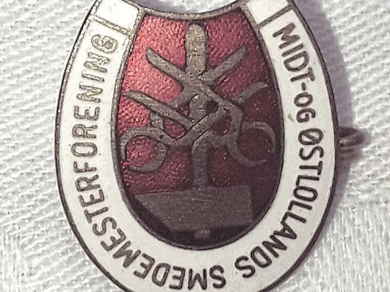 Billede 1 - Emblem. Midt og Østlollands smedemesterforening