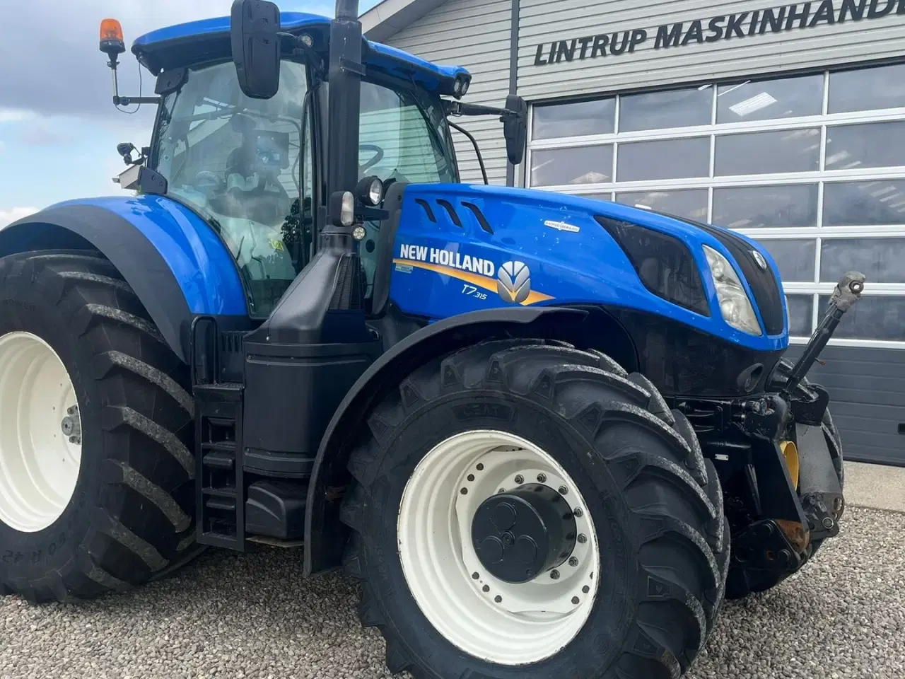 Billede 20 - New Holland T7.315 HD med frontlift og front PTO, samt NYE 650mm fordæk og store 900mm hjul.
