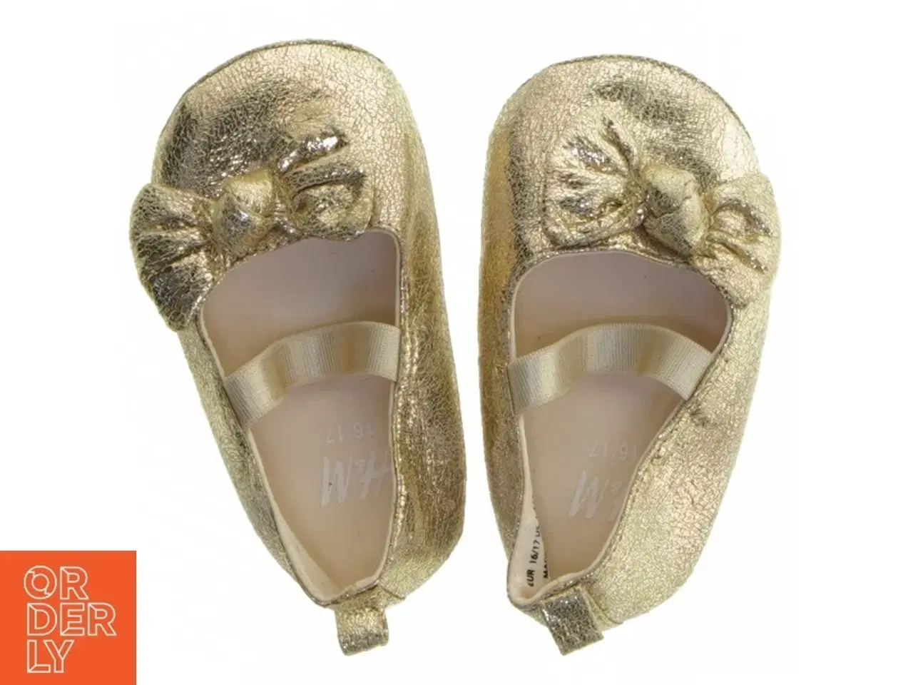 Billede 1 - Guld babysko med sløjfe fra H&M (str. 16-17 )
