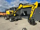 Wacker Neuson EW 100  Gummihjuler med rotortilt, vogn og fuld skovlpakke - 2