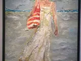 Ung kvinde på strandtur "