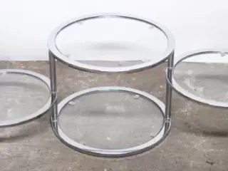 Rundt bord i glas og stål