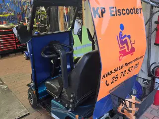 Elscooter med tag