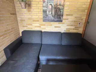 Sovesofa chaiselong m opbevaring i mørkegråt stof