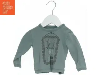 Langærmet bluse med motiv fra Fixoni (str. 62)