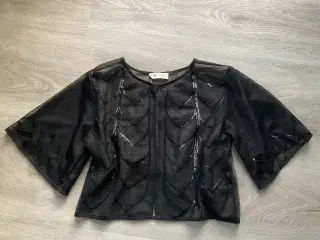 Sort bolero med pailletter str. 146/152