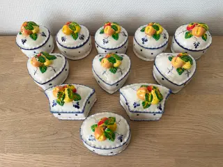 Krukker med frugt-dekoration på låget