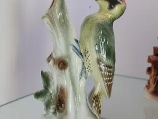 Fugl på stamme og lille vase