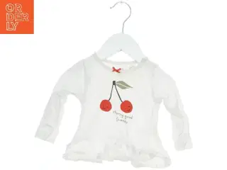 Langærmet bluse med kirsebærmotiv fra H&M (str. 62)