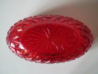 Rød jardiniere i glas