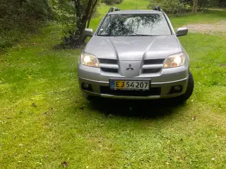 Hej sælger eller bytter den  MITSUBISHI OUTLANDER 