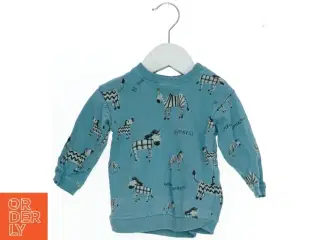 Langærmet bluse med zebra design fra H&M (str. 74)