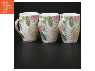 Porcelænskrus med blomstermotiv (str. Ø. 8 cm. længde, 10 cm)