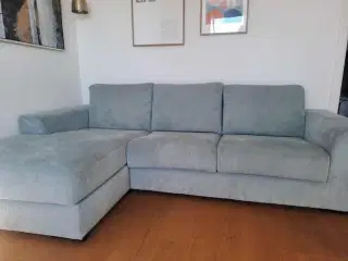 Flot hjørnesofa i grøn fløjl 