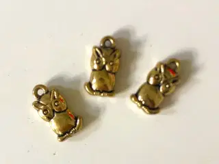 3 gyldne charms med ugler