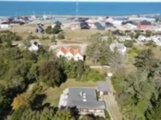 Hus t�t p� strand, marina, indk�b og Golfbaner