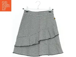 Nederdel med hundetandsmønster og flæser fra Lemon Beret (str. 152)