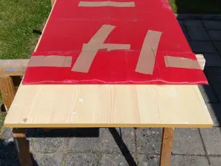 Stænkplade i rustfrit stål.