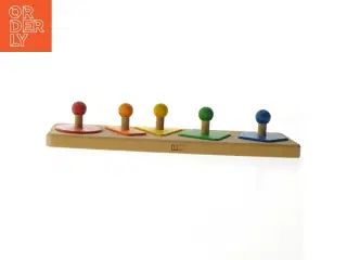 Træ-puslespil med farvede former (str. 36x10 cm)