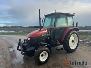 New Holland L 75 / Fiatagri traktor med kost