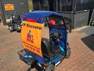 Elscooter med tag