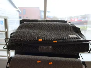 Hylde med dørmåtter