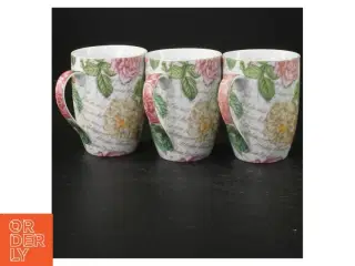 Porcelænskrus med blomstermotiv (str. Ø. 8 cm. længde, 10 cm)