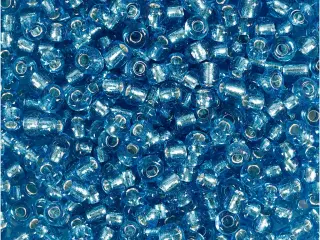 Rocaiperler, diam. 3 mm, str. 8/0, hulstr. 0,6-1,0 mm, turkis klar, 25g/ 1 pk.
