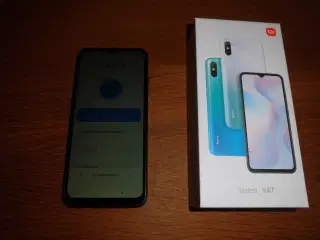 Xiaomi Redmi 9AT mobiltelefon med tilbehør