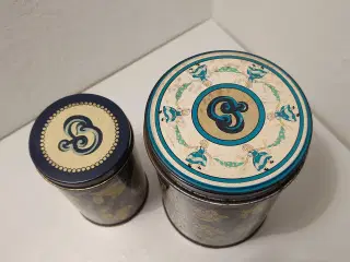 Irma dåser: 2 stk runde. Højder 10,5 og 14 cm.