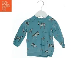 Langærmet bluse med zebra design fra H&M (str. 74)