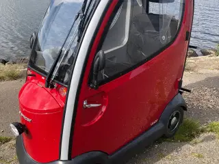 Elektrisk cabine scooter med oliefyr