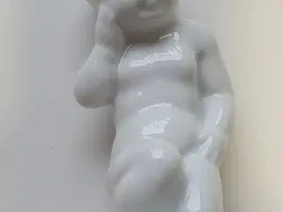 Porcelænsfigur - barn på hug med tandpine