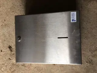 Papir dispenser i rustfrit stål.