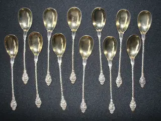 12 toddyskeer af sølv