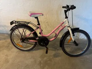 Pigecykel i lyserød og hvid