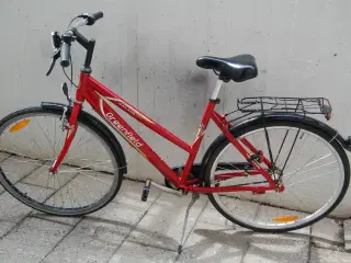 Velkørende damecykel med lys og lås