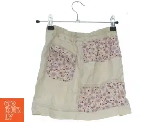 Beige nederdel med blomsterprint fra H&M (str. 122)