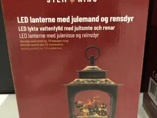 Lanterne med julemand og rensdyr med vand og sne o