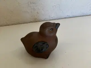 Sort og brun keramik fugl