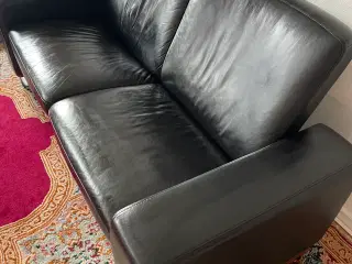 Stresslet 2  prs sort læder sofa 