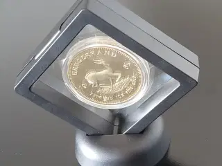 Krugerrand medalje i uædelt metal i bordholder 