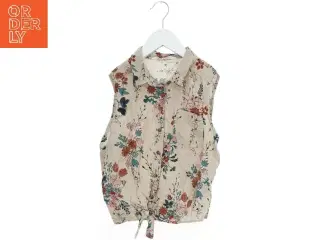 Bluse uden ærmer med blomstermønster fra H&M (str. 164)