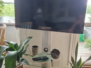 Tv i mærket Sony med bord