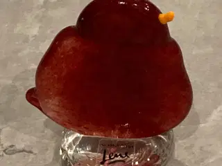 Rød fugl i glas