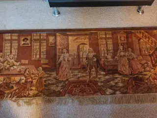 Vægtæppe med flot motiv ophængt i træliste