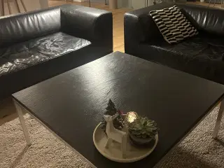 Flot sofabord med sort skiferbordplade