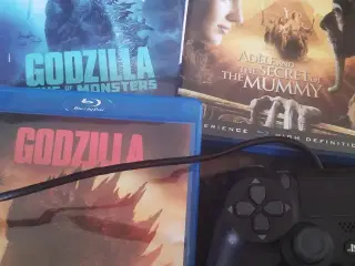 PlayStation Pro med spil og to Godzilla film.